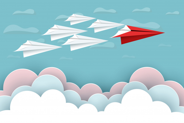 avión de papel rojo y blanco vuelan hasta el cielo entre el paisaje natural de la nube van a apuntar concepto de liderazgo de startup de éxito empresa