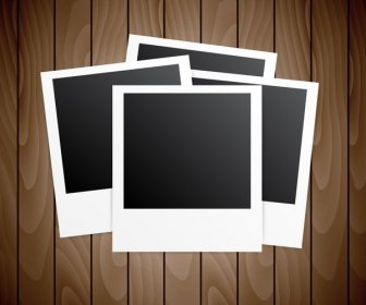 Four Blanks Photo Frames On Wooden