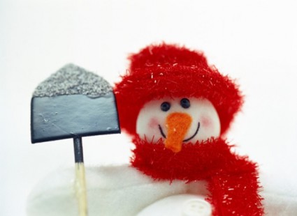 Fotos de hd lindo muñeco de nieve para tomar una pala
