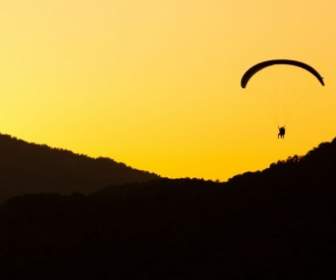 Paragliding At Sunset