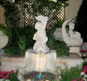 Statues In Flower Garden